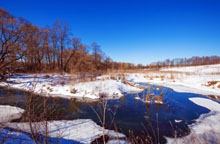 depositphotos_65778177-stock-photo-forest-river-with-snow-at